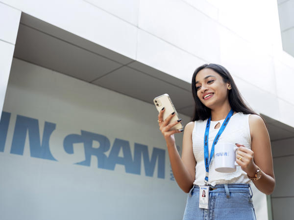 Female Walking Outside With Phone And Coffee