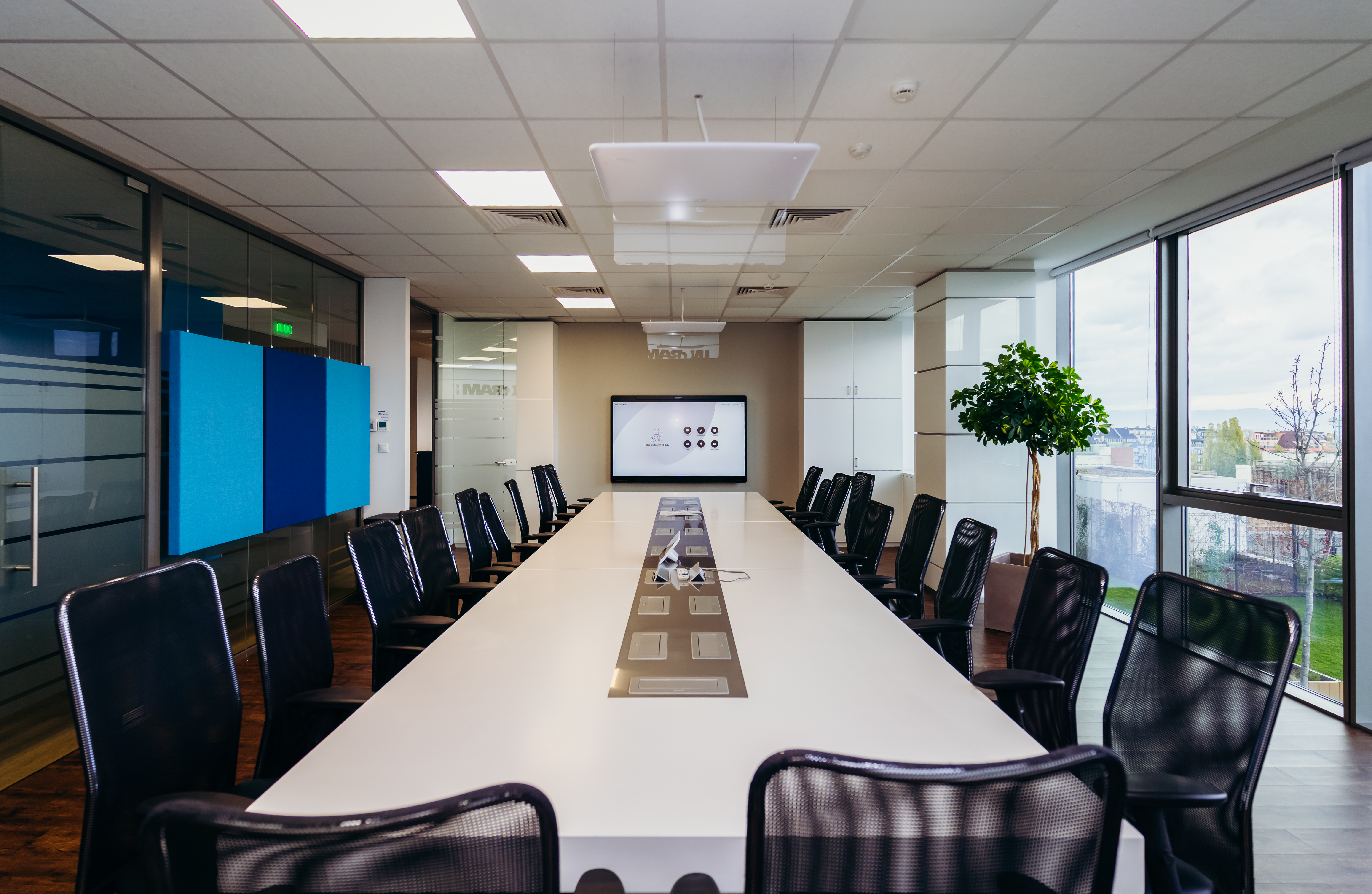 a conference room with a large table and chairs