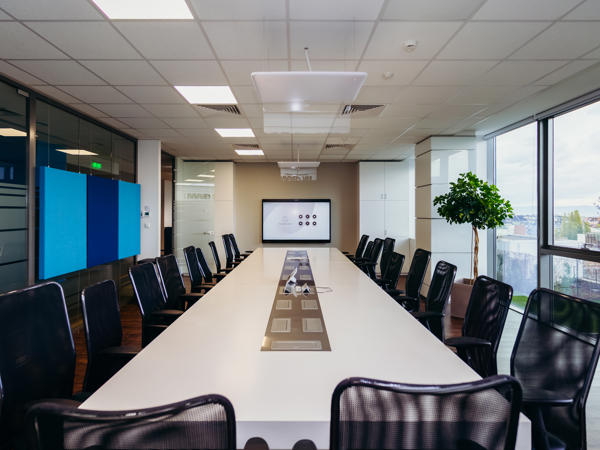 a conference room with a large table and chairs
