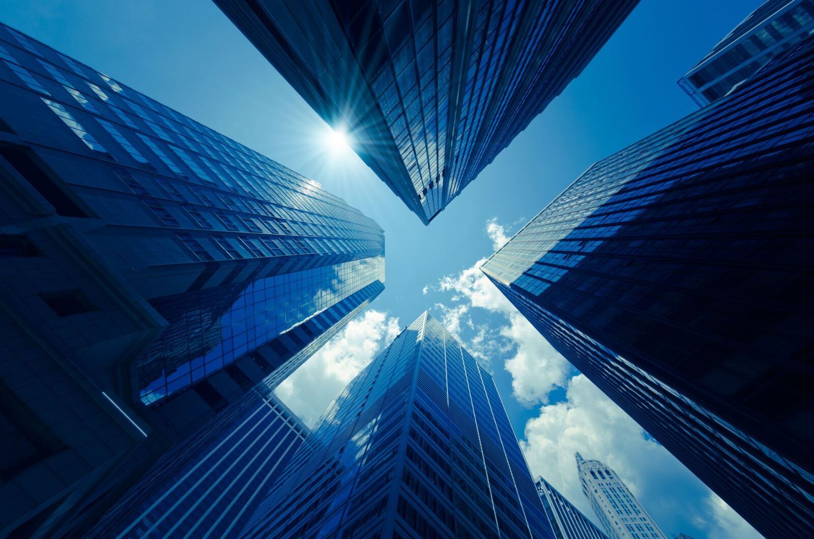 looking up view of tall buildings
