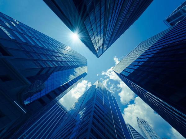 looking up view of tall buildings