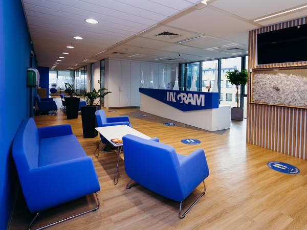 a blue couches and tables in a room