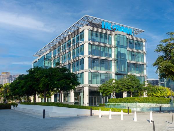 a building with trees and a blue sky