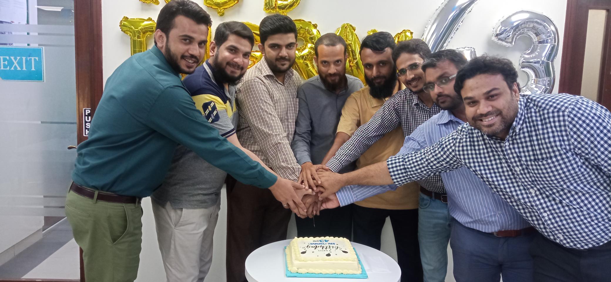 a group of men holding hands together