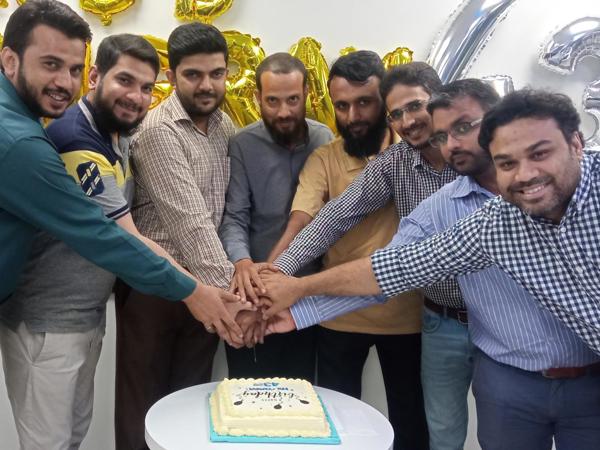 a group of men holding hands together