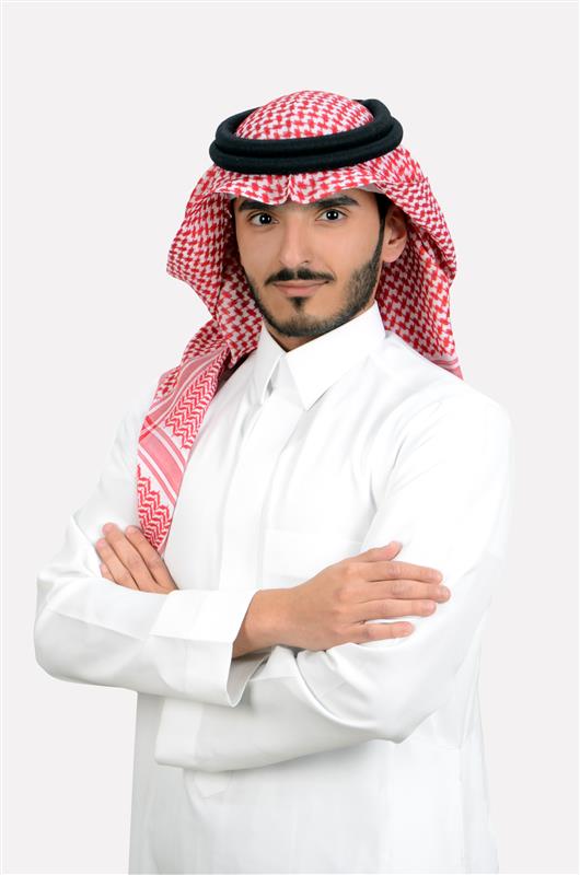 a person with a beard wearing a red and white headdress