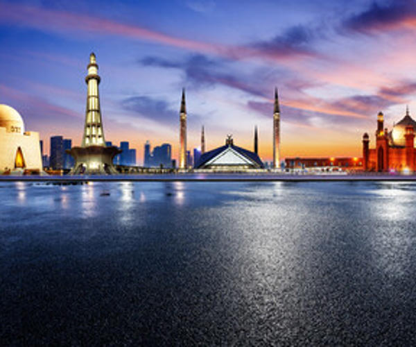 a city skyline with a body of water