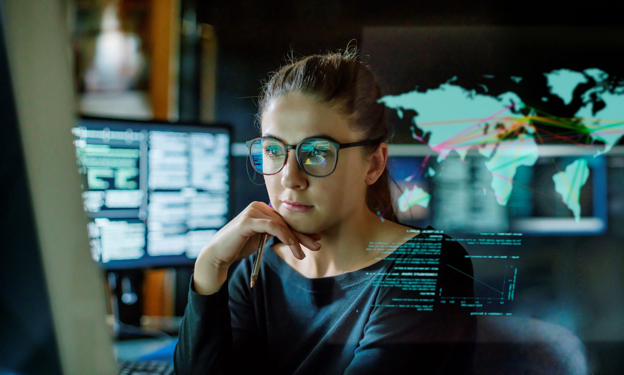 a person sitting in front of a computer screen