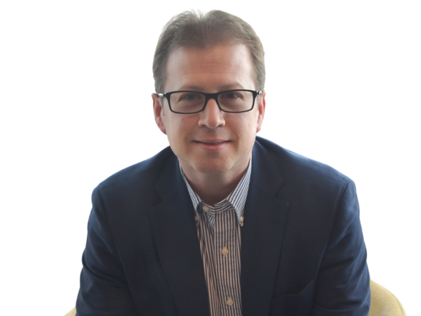 a person in a suit and glasses
