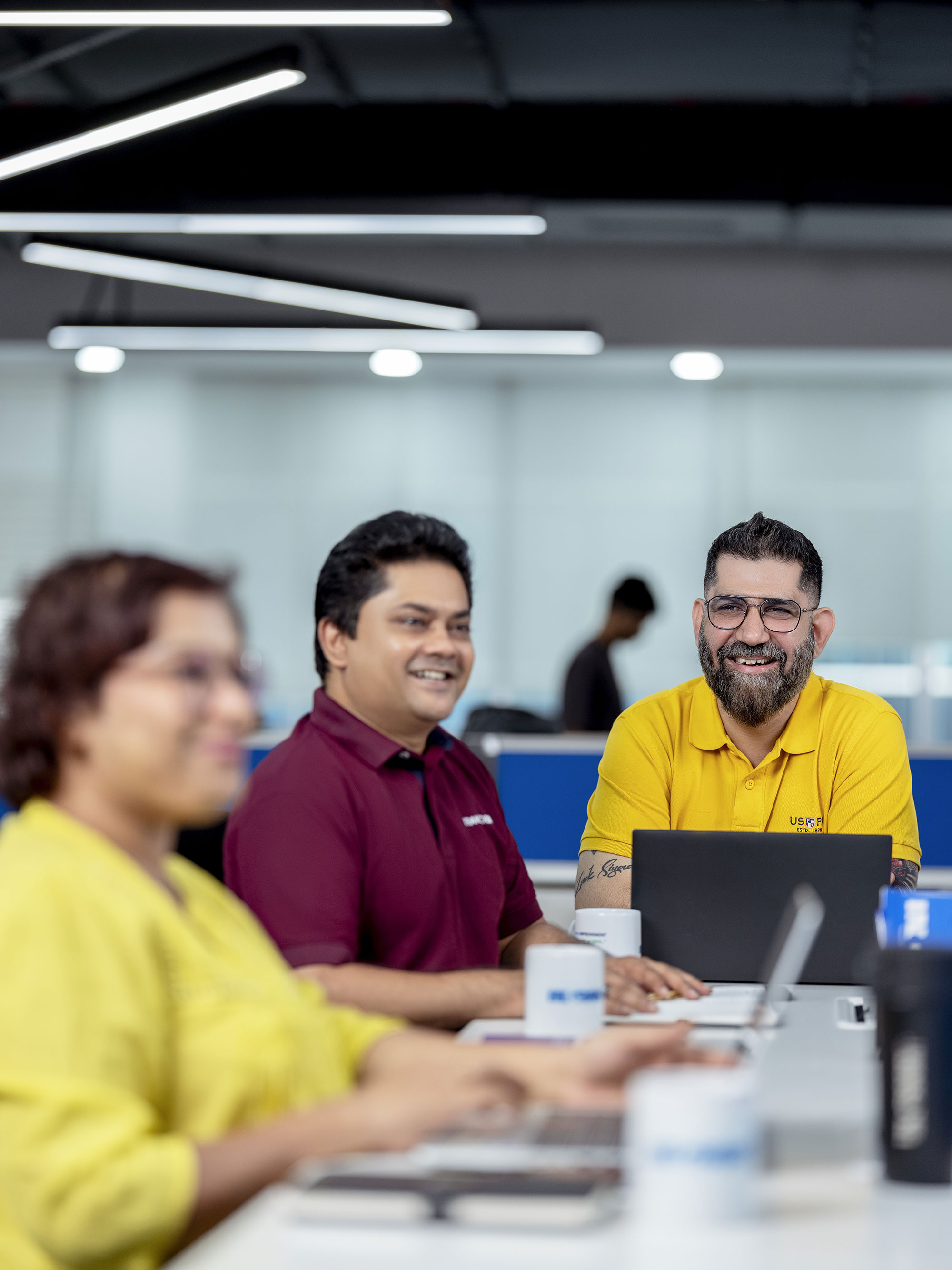Three Associates Engaging In A Meeting