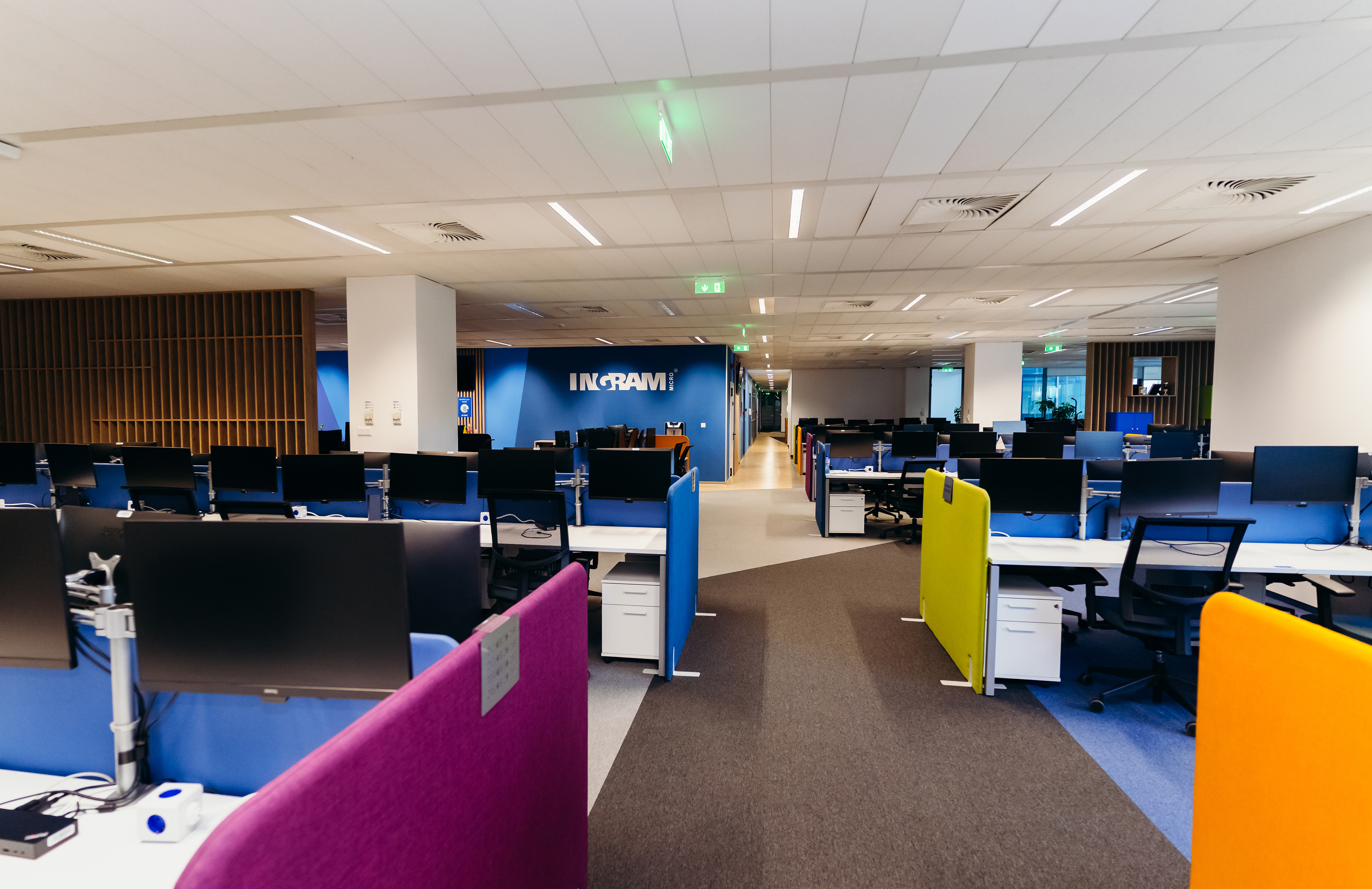 an office with colorful cubicles