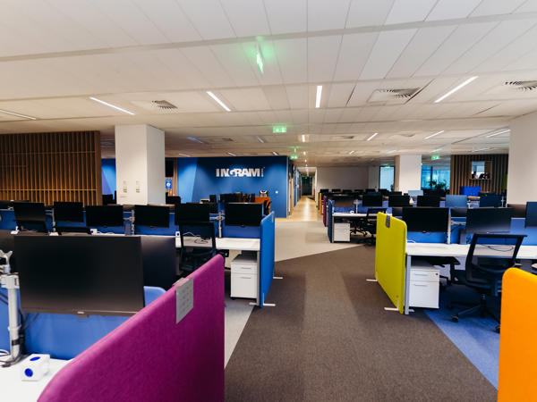 an office with colorful cubicles
