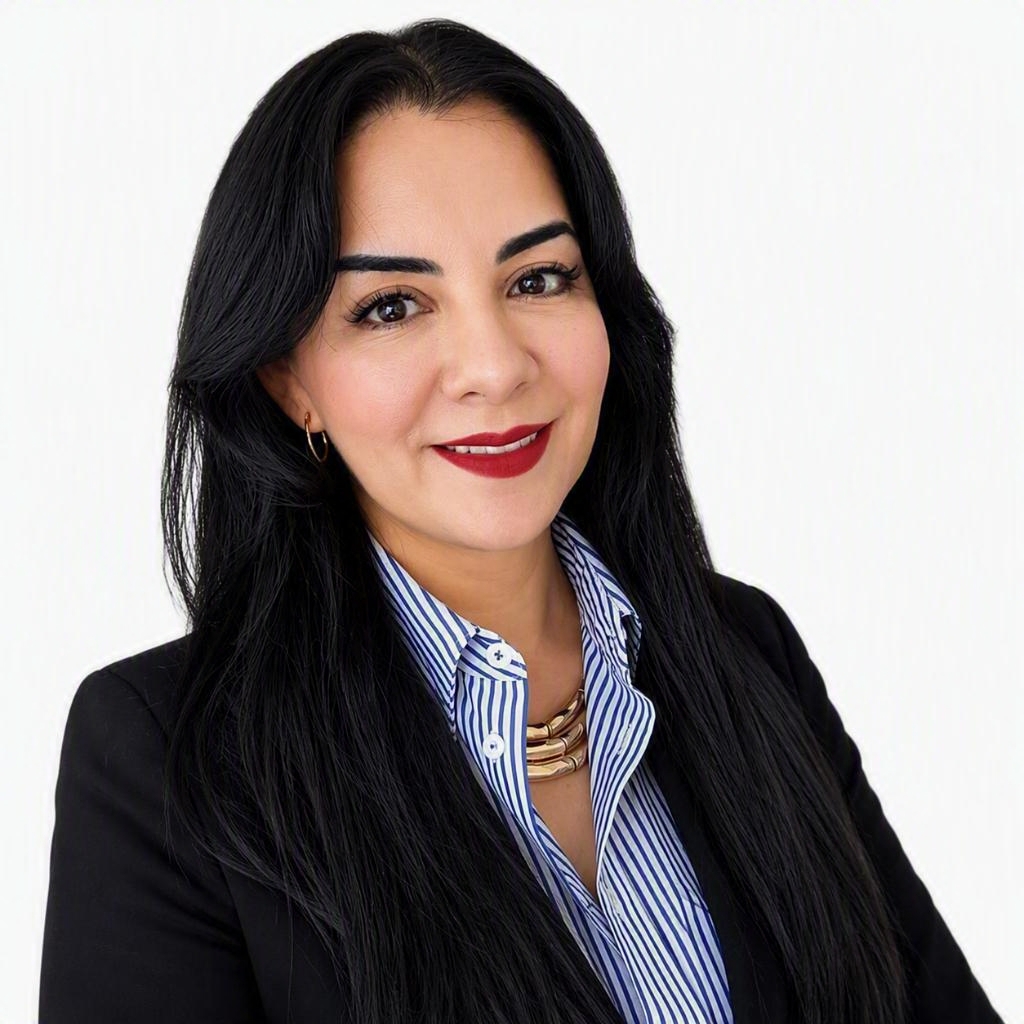 a person with long black hair wearing a black suit and striped shirt