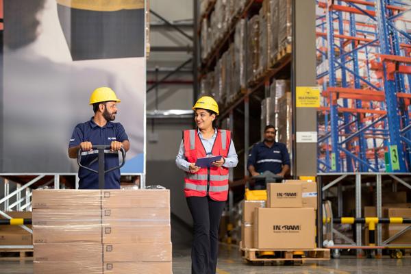 a person and person in a warehouse