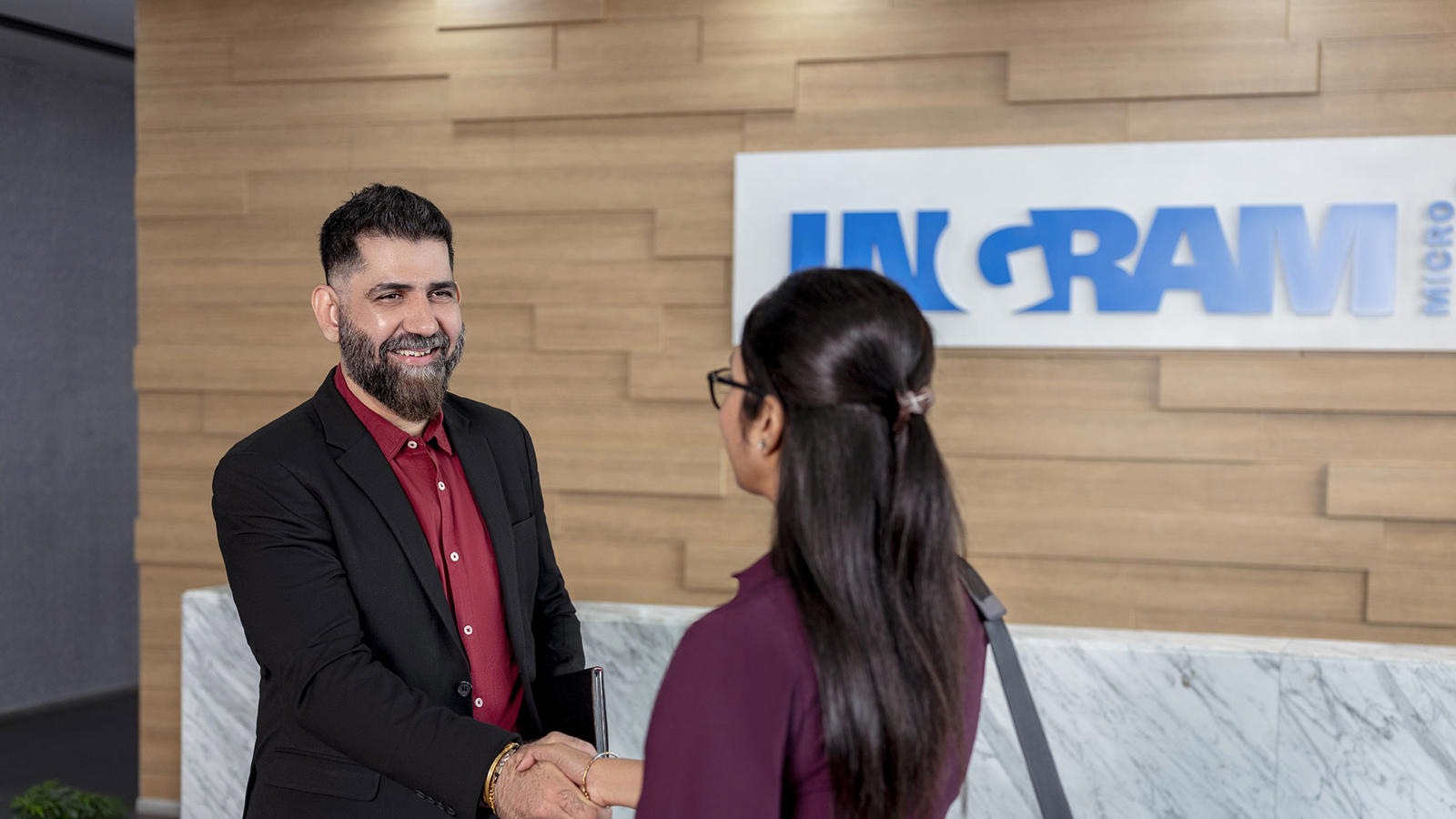 Two People Meet In The Reception Area