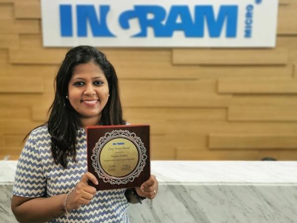 a person holding a plaque