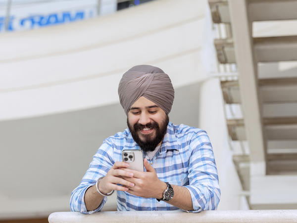 Associate Smiling With Mobile Phone
