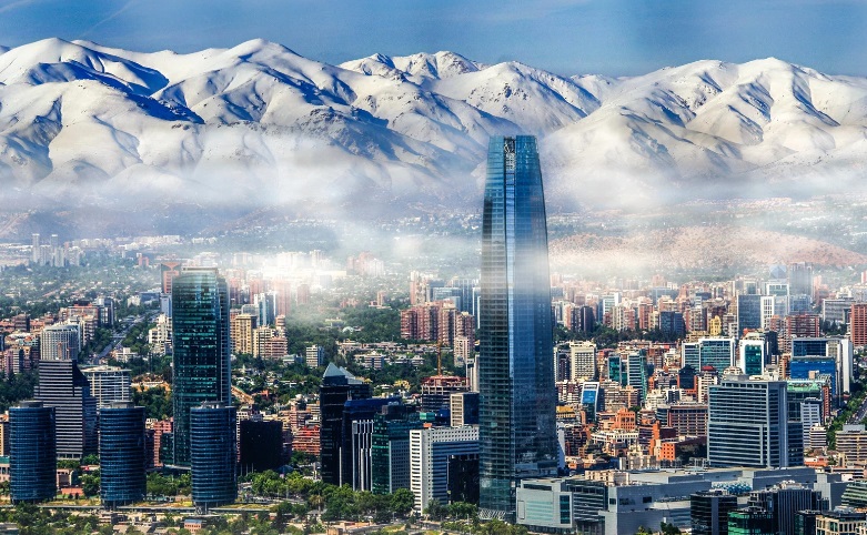 a city with mountains in the background
