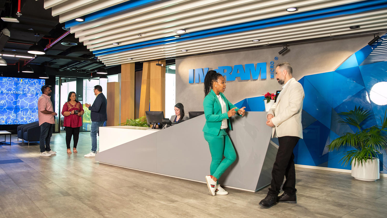 Five Associates Meeting In The Reception Area