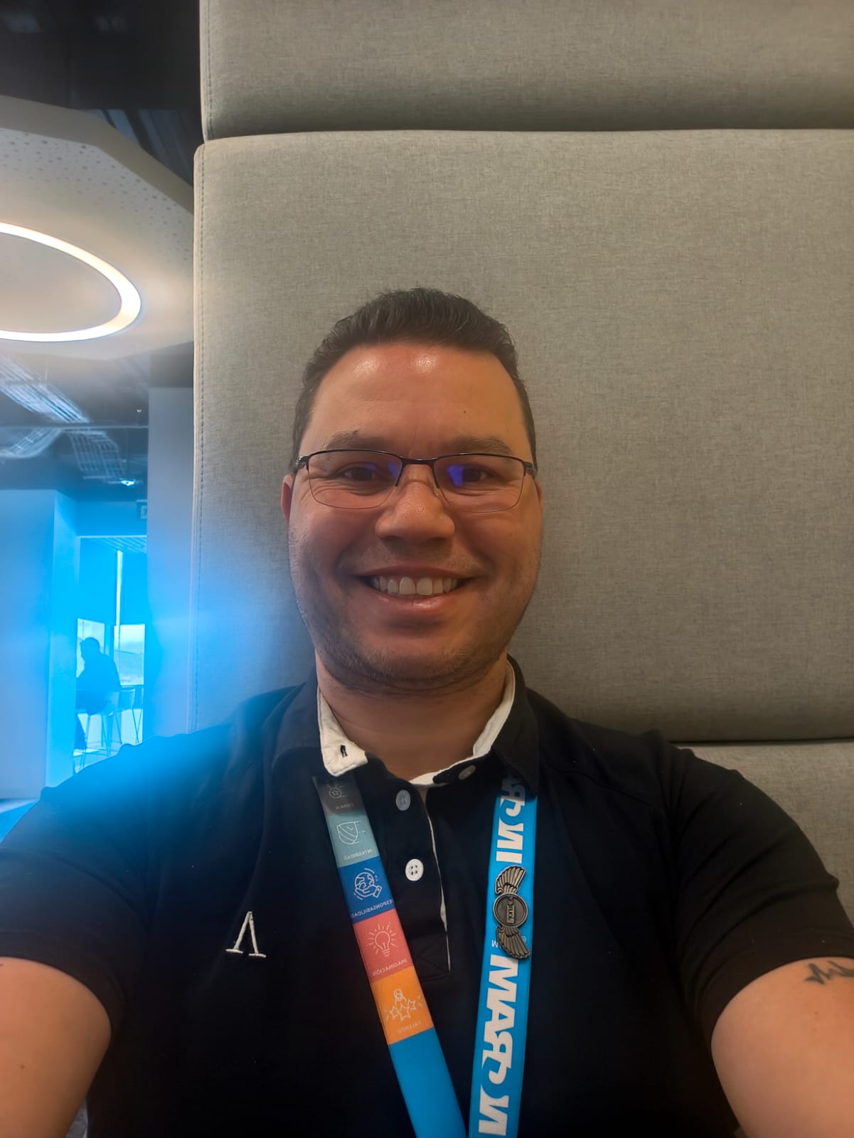 a person wearing glasses and a black shirt