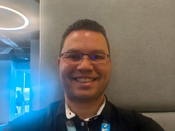 a person wearing glasses and a black shirt