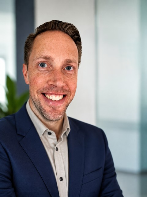 a person smiling at the camera