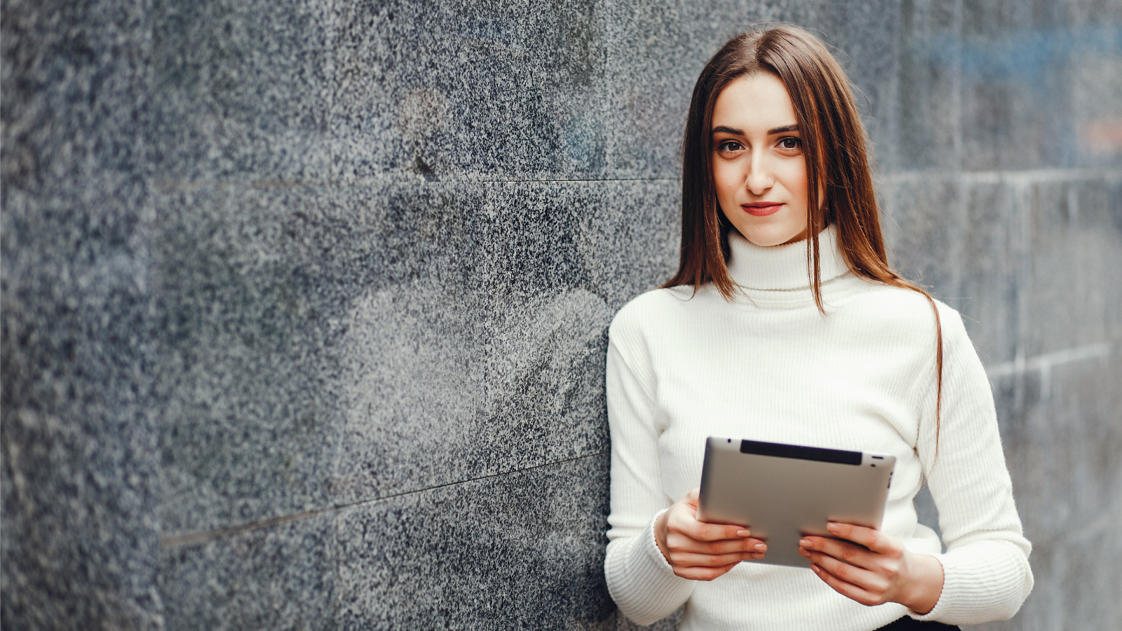 a person holding a tablet