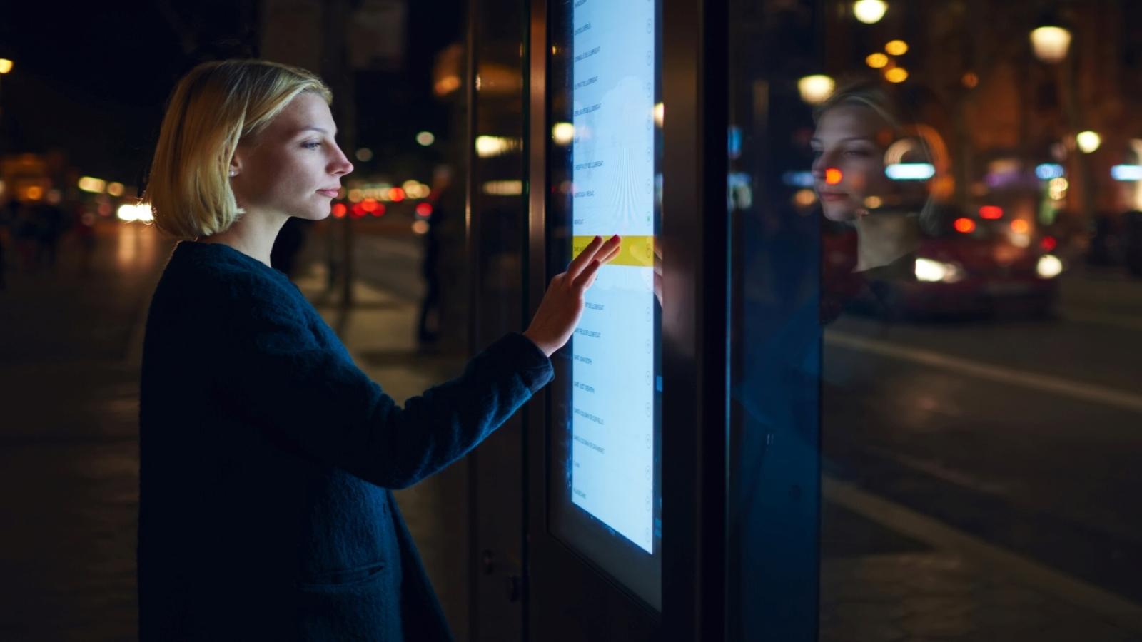 a person touching a touch screen