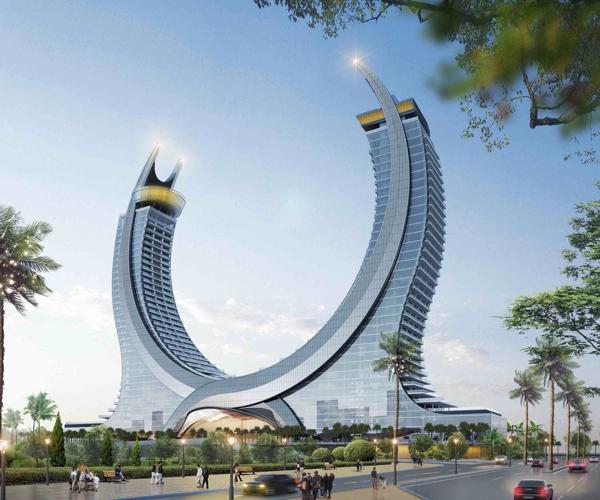 a large curved building with a couple of curved towers