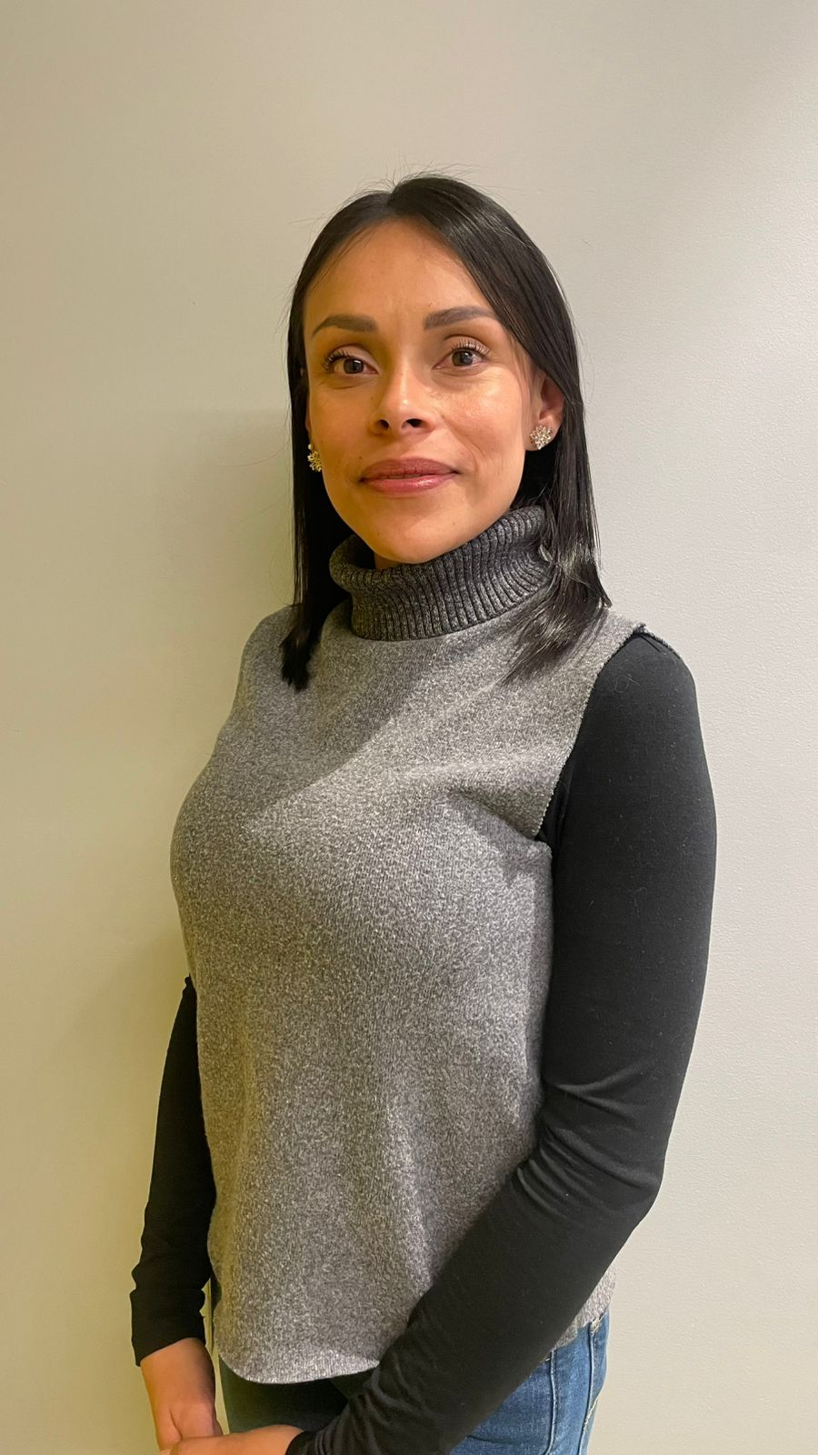 a person in a turtleneck sweater