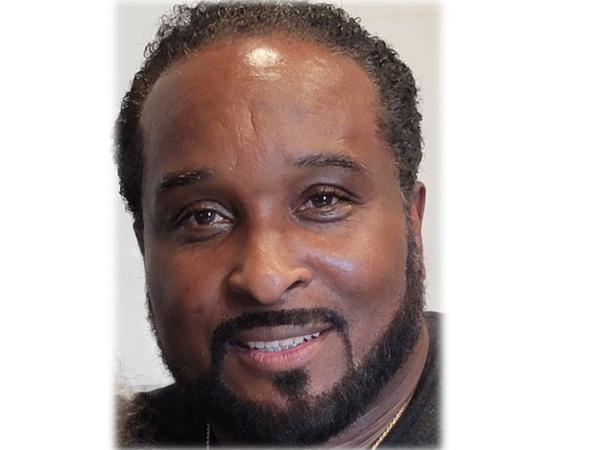 a person with a beard smiling