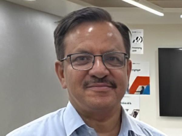 a person with a mustache wearing glasses