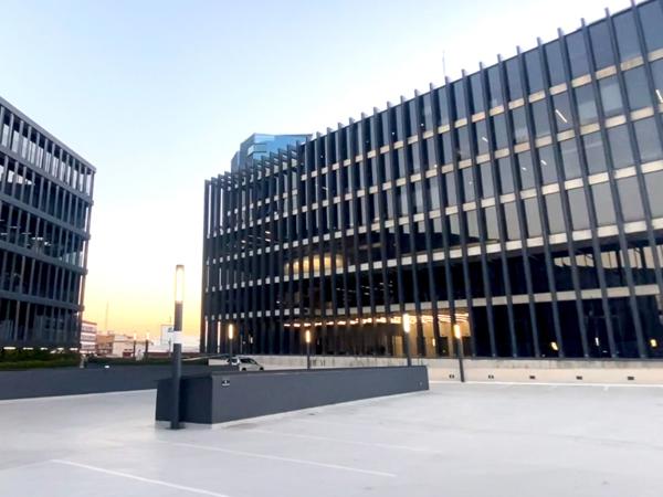 a building with windows and a parking lot