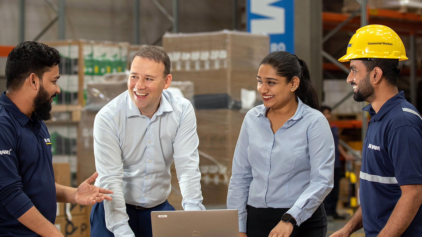 Four Associates Meeting In A Warehouse