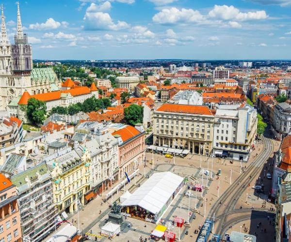 a city with persony buildings and a street