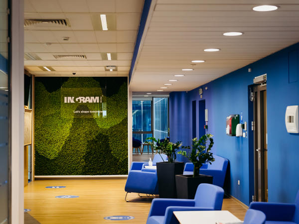 a blue room with blue chairs and a green wall
