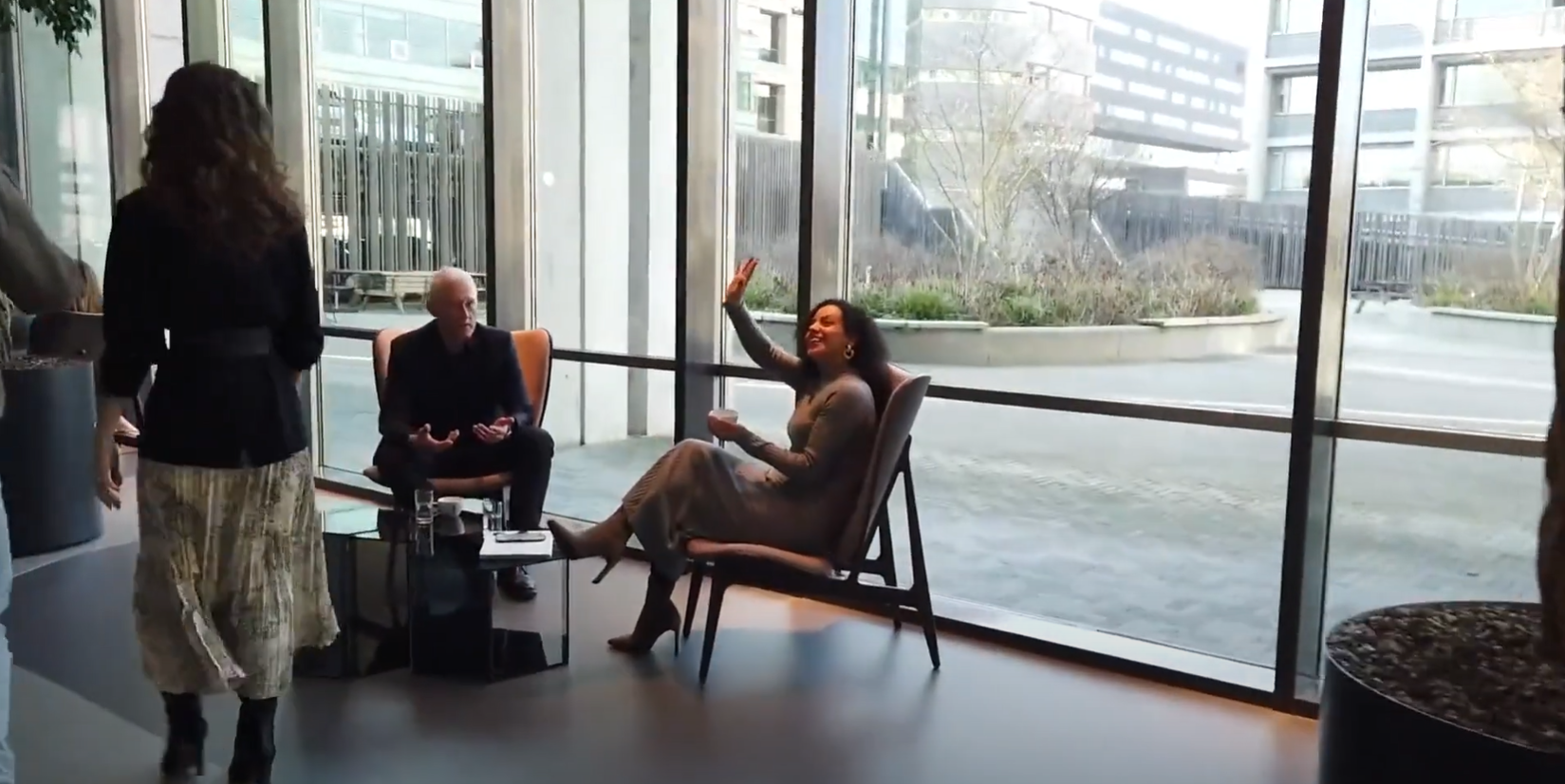 a person sitting in chairs and a person sitting in chairs