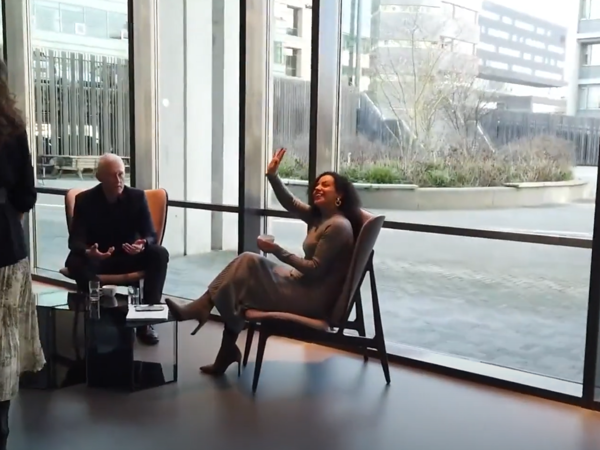 a person sitting in chairs and a person sitting in chairs