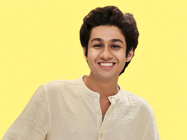 a person smiling at the camera