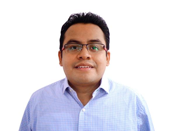 a person wearing glasses and a blue shirt