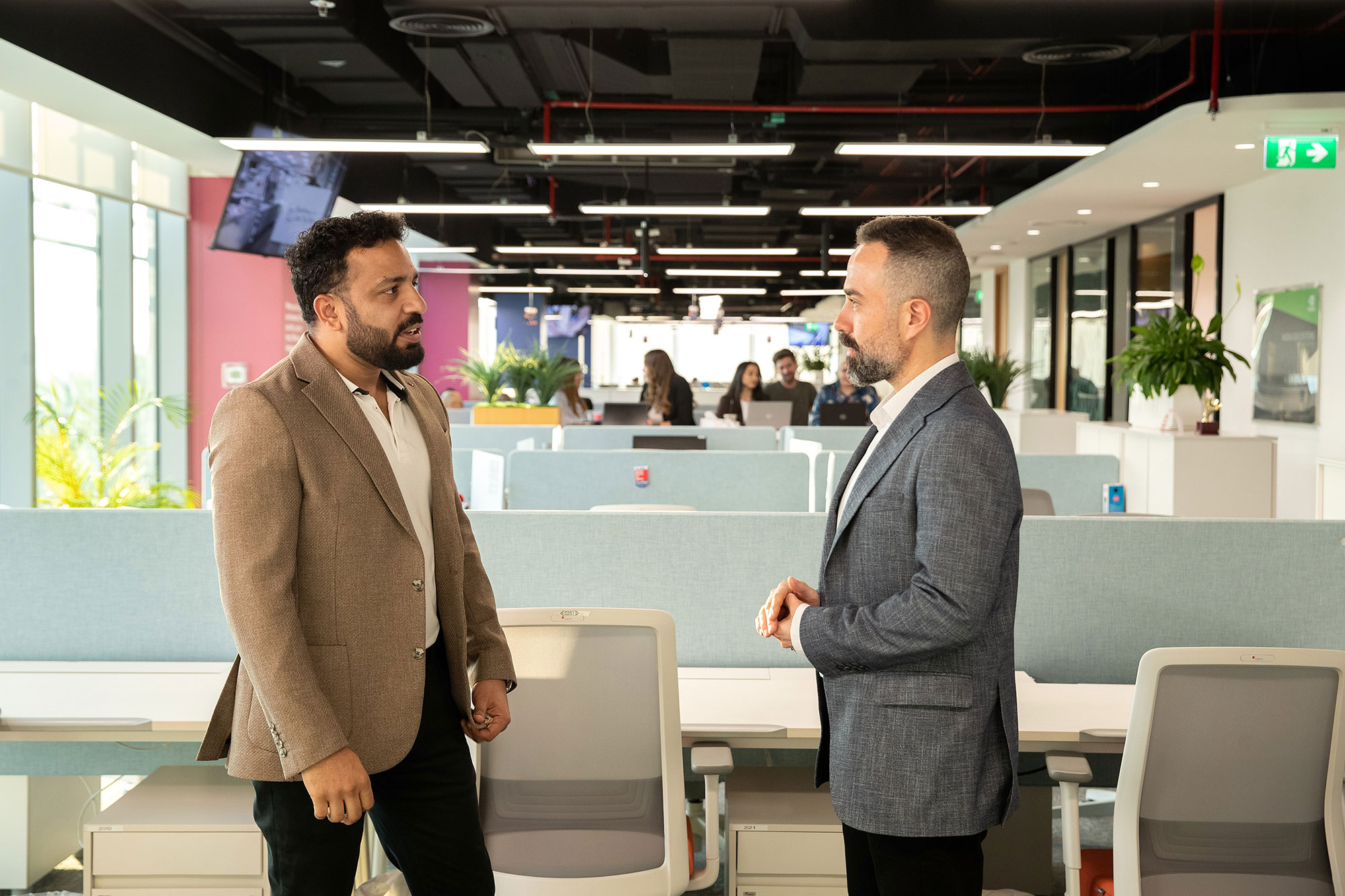 Two Associates Speaking With Each Other