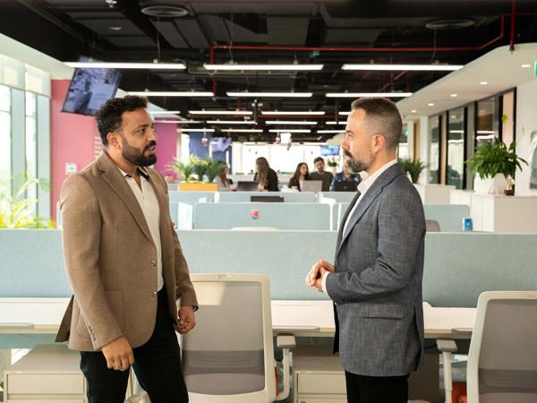 Two Associates Speaking With Each Other