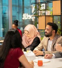 a group of people sitting around a table