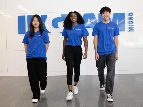 a group of people in blue shirts