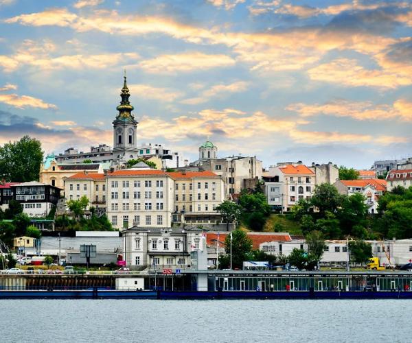 a city with buildings and a body of water