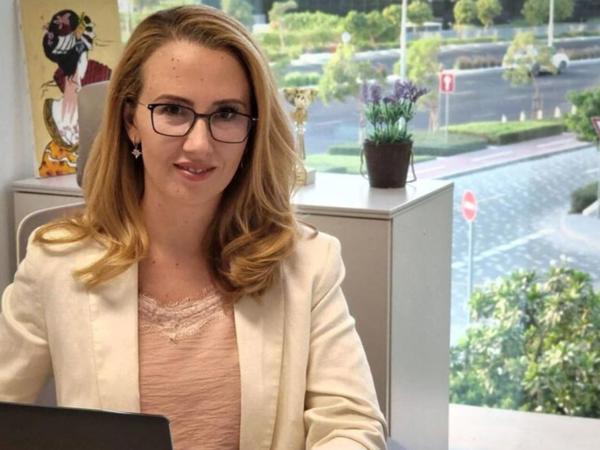 a person sitting at a desk with a laptop