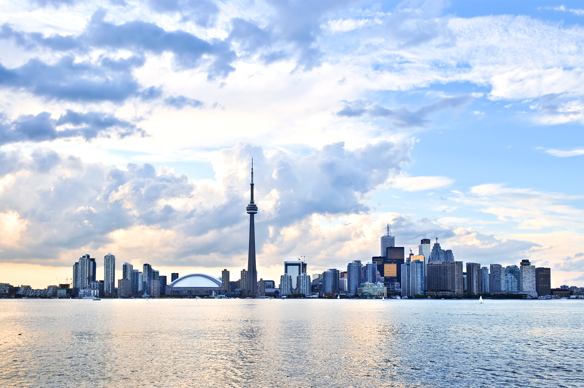a city skyline with a body of water