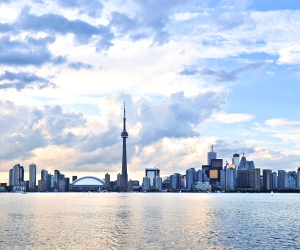 a city skyline with a body of water