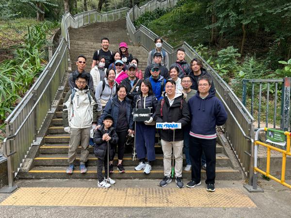 a group of people posing for a photo on stairs