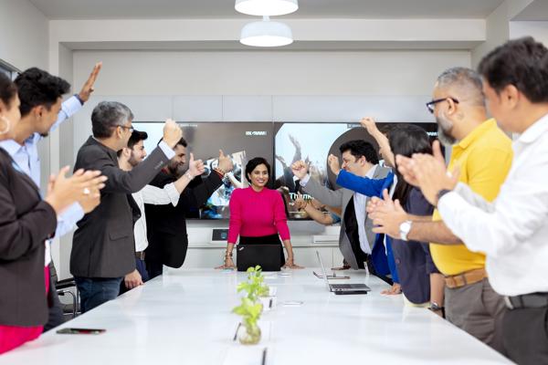 a group of people raising their hands
